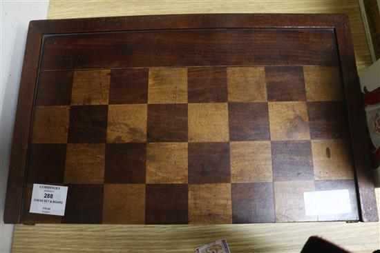 A Victorian chess board, with chess set, dominos and chequers